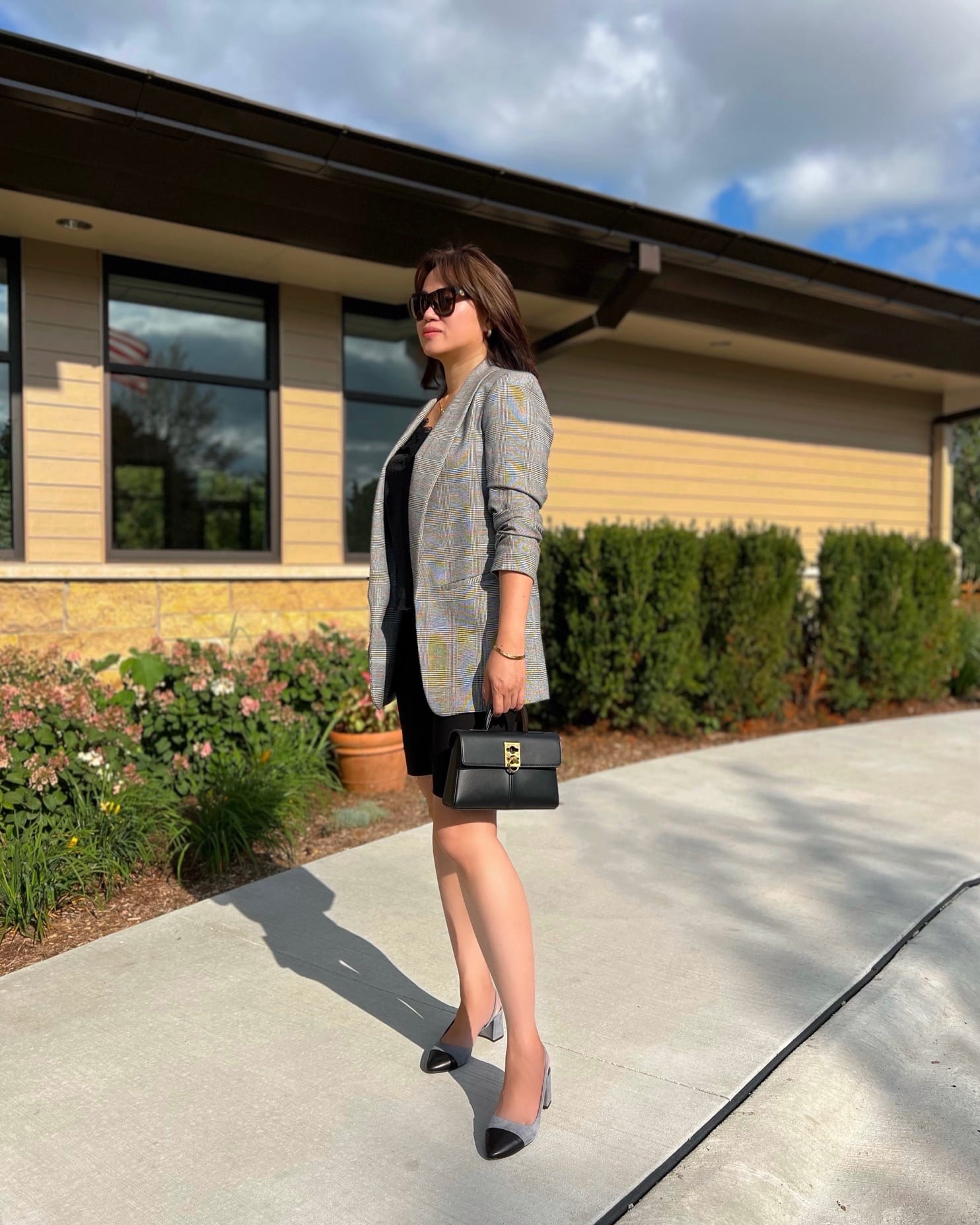 Office look showing how to style a classic blazer for every season